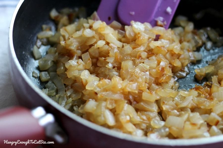 Image of diced vidalia onion sauteed in a pan.