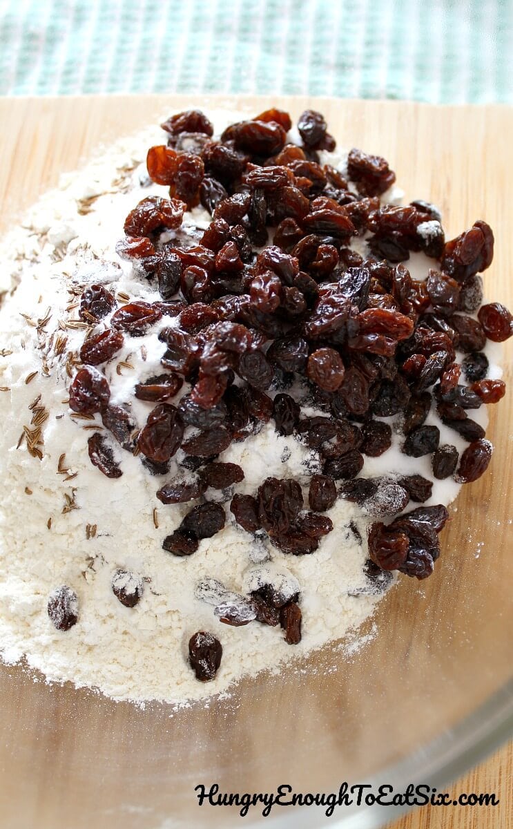 Image of bowl holding dry ingredients and loads of raisins for Irish Soda Bread.