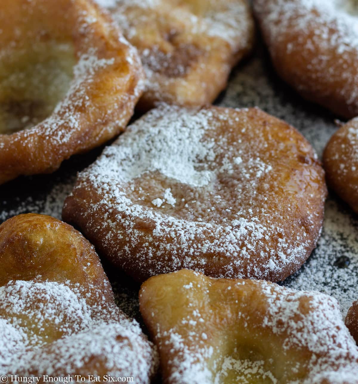 Fried dough with a sprinkle of white powdered sugar