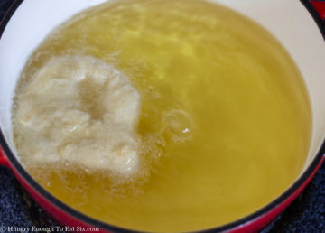 Bubbling oil around a piece of dough