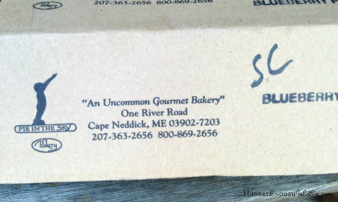 Side of a pie box with bakery address.