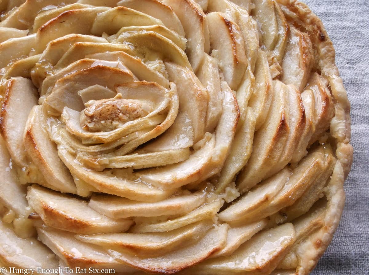 Tart topped with apple slices in spirals