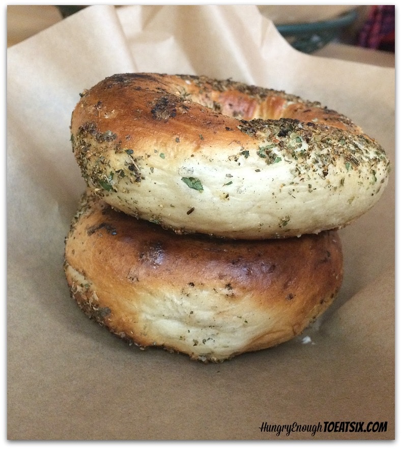Two bagels with herb blend on outside