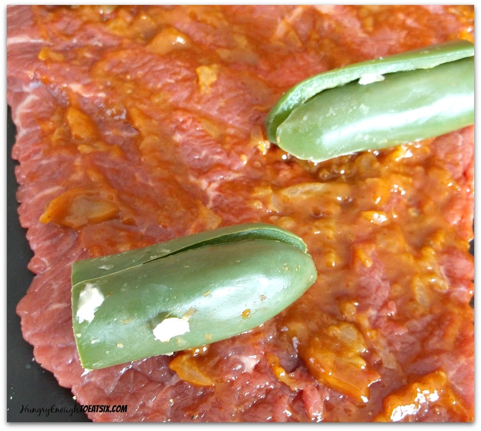 London broil spread with chipotle sauce, and the jalapenos placed on top.