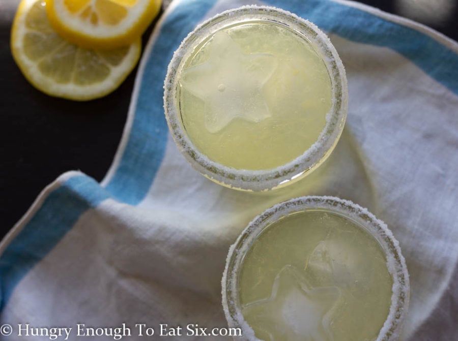 2 glasses of lemon margarita with salted rims.