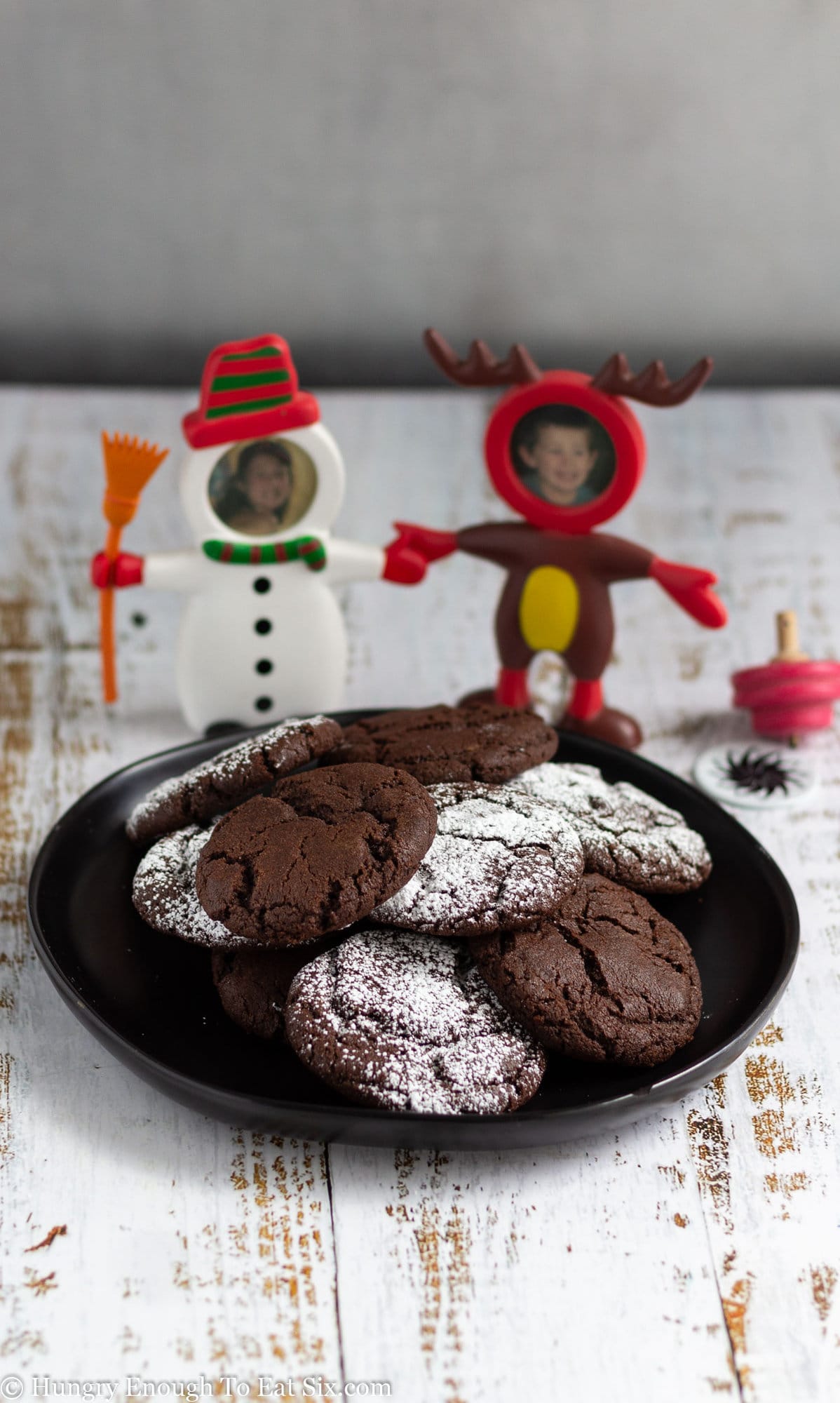 Holiday photo frame characters with a plate of chocolate cookies