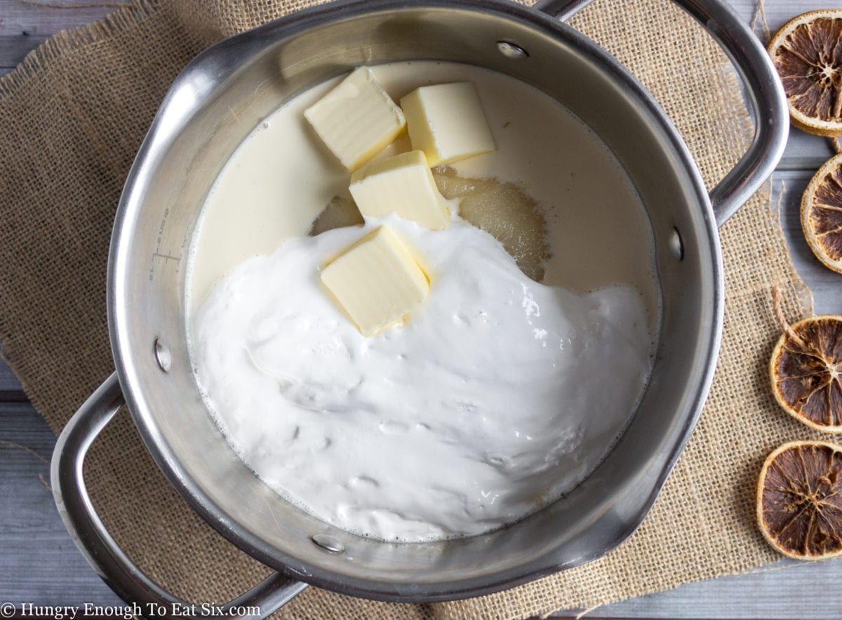 Butter, milk, and marshmallow in a bowl