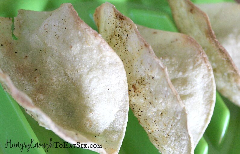 Baked corn tortillas on a green plate