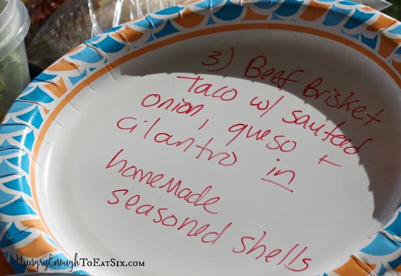 Paper plate with blue pattern and red writing