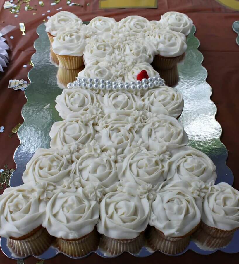The Bridal Shower Cupcakes are arranged in three designs: a wedding dress, an engagement ring and a tuxedo.