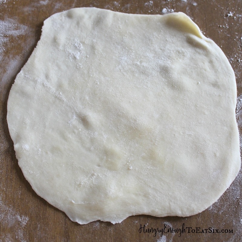 Pie crust dough disk rolled out.