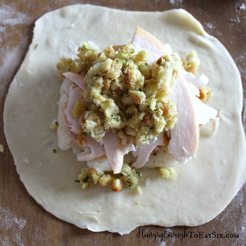 Pastry disk with potatoes, turkey, and stuffing layered on