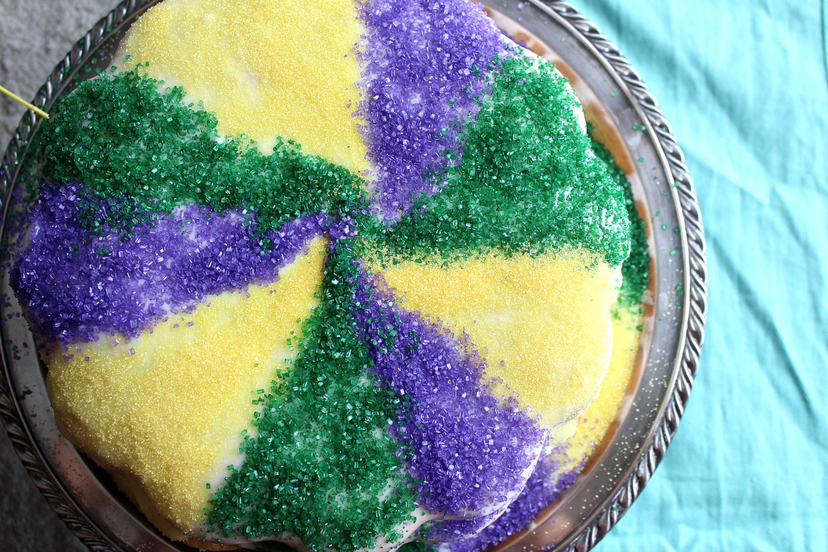 A King Cake for Mardi Gras, with flavors of nutmeg and a cinnamon-pecan streusel. And of course a baby hidden inside one of the Fillables Cake Pan pockets!