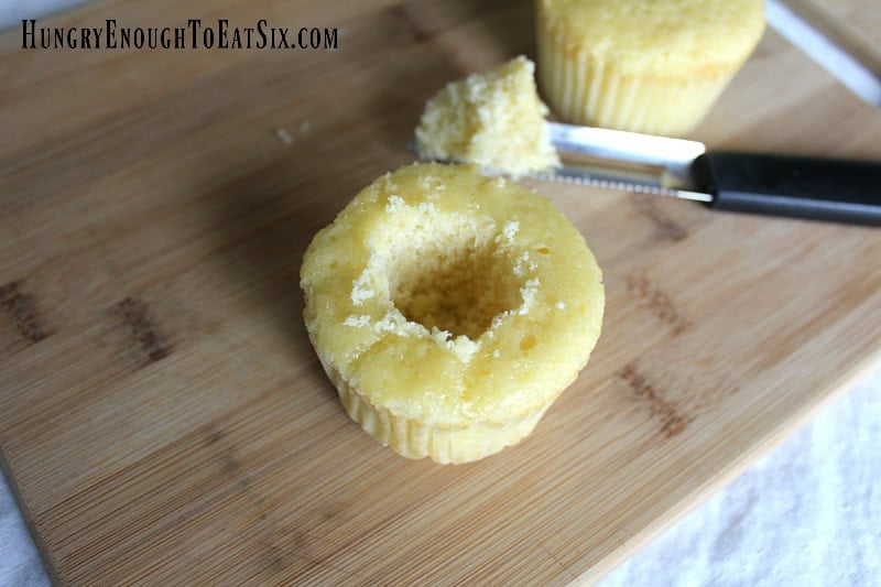 Yellow cake cupcake with center removed for Easter surprise cupcakes.