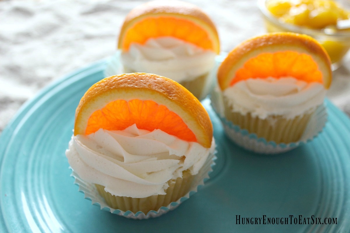 Orange slices on frosted cupcakes