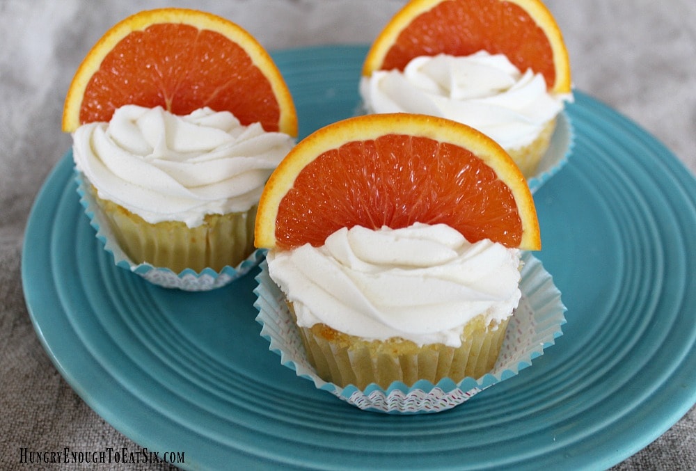 Orange topped frosted cupcakes