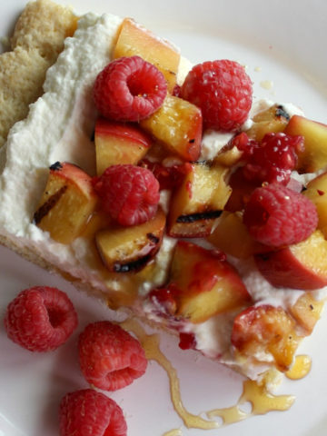 Peaches drizzled honey over cream and shortcake