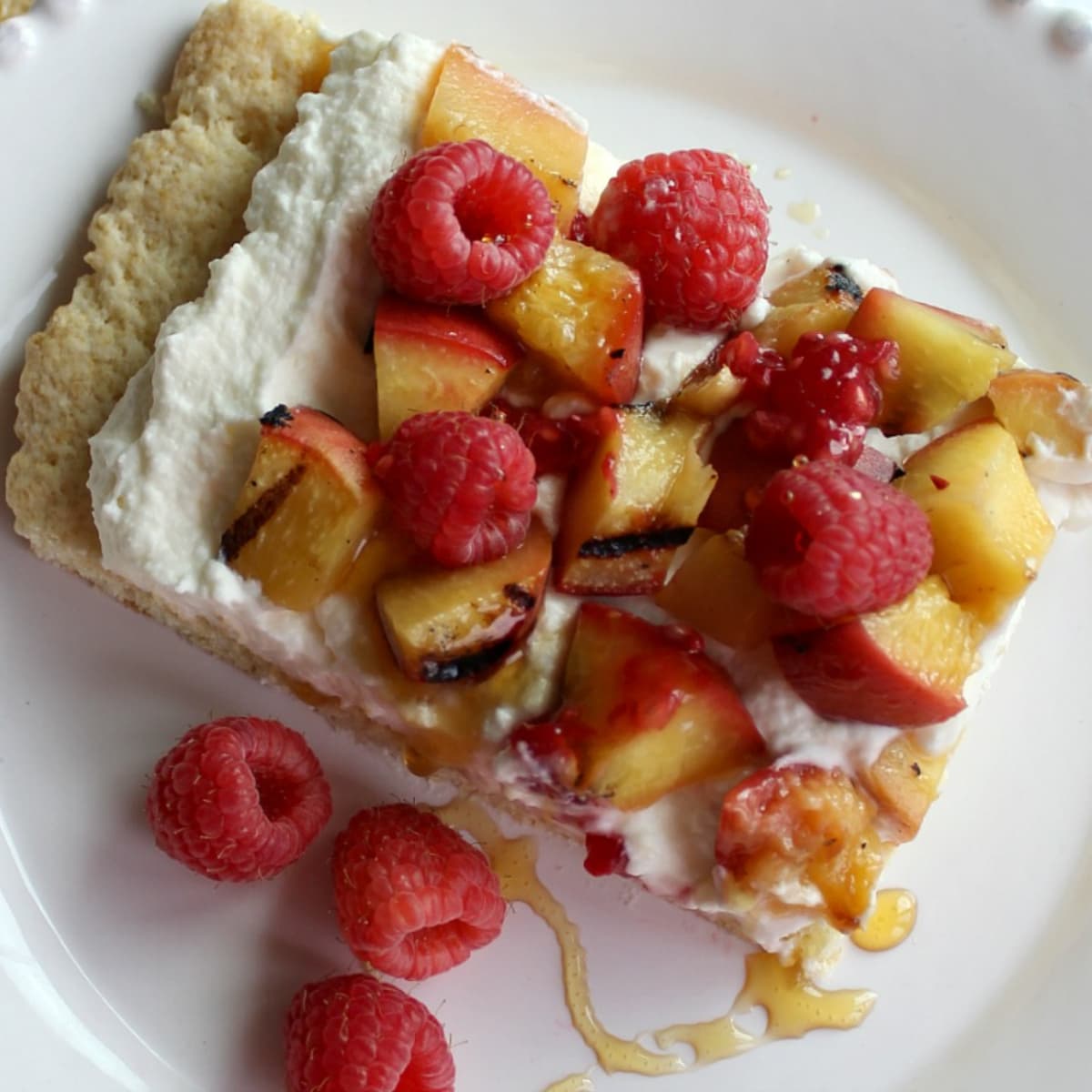 Peaches drizzled honey over cream and shortcake