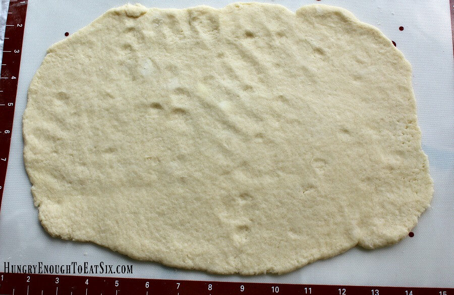 Shortcake dough rolled out on parchment paper
