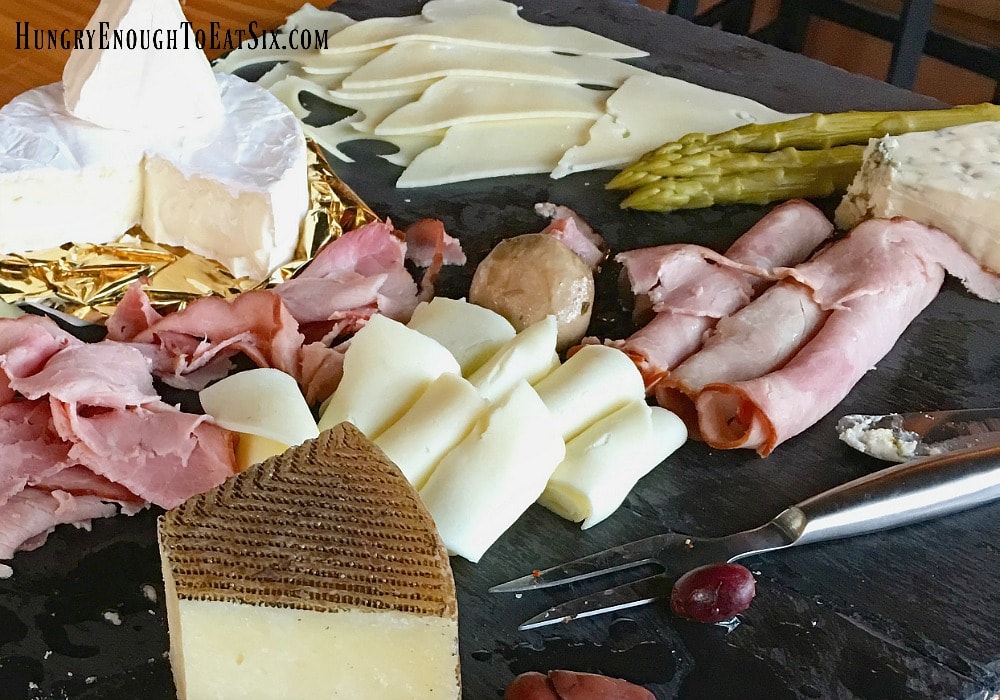 array of gourmet cheese and meats