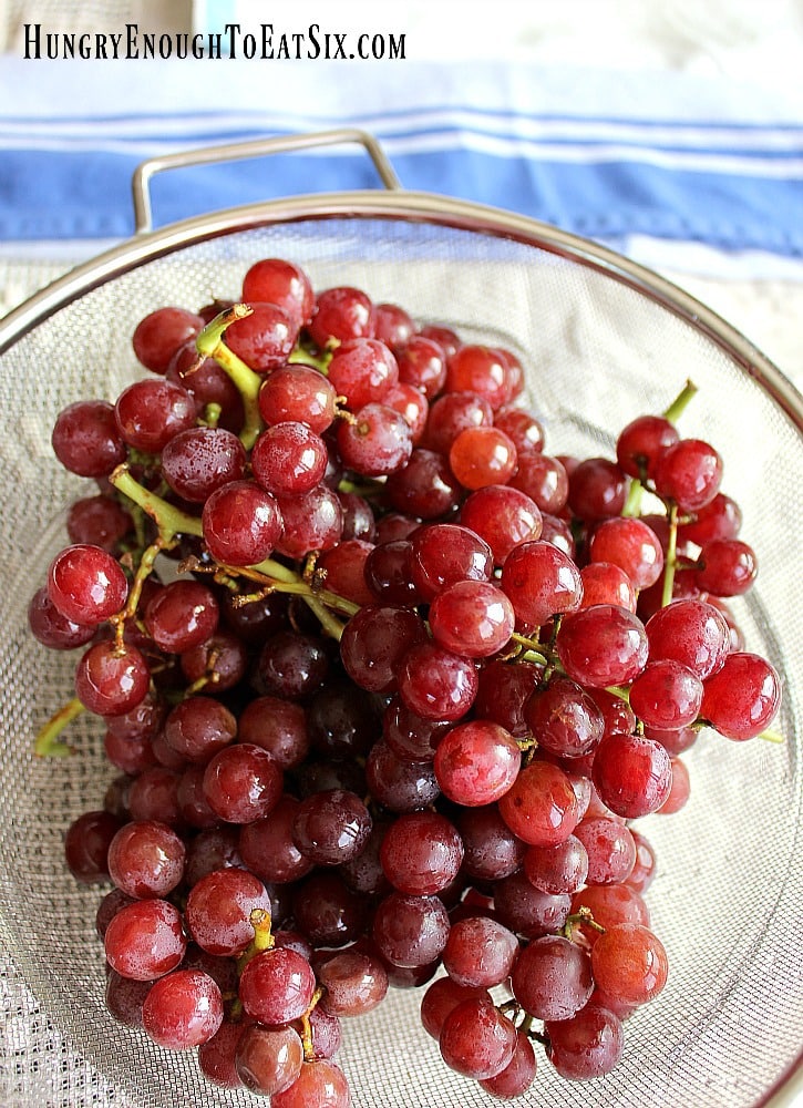Red grapes in strainer