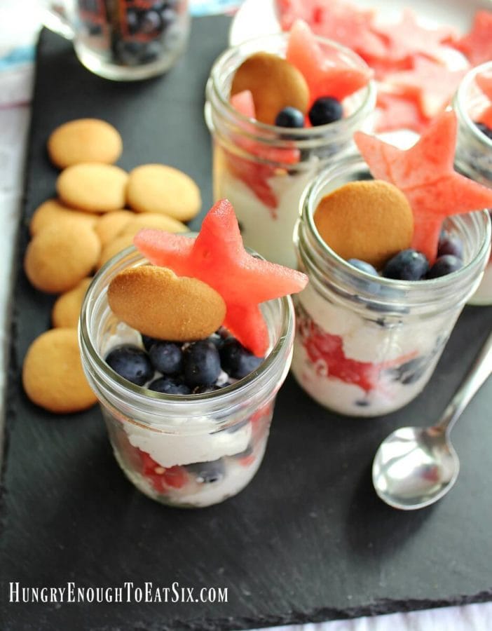 A layered fruit and cream dessert variety of fool! This fool boasts red, white and blue in the form of red watermelon stars, fresh, white whipped cream and juicy blue blueberries. Topped with a cookie. A sweet, vanilla, crunchy cookie to complete this fruity fool.