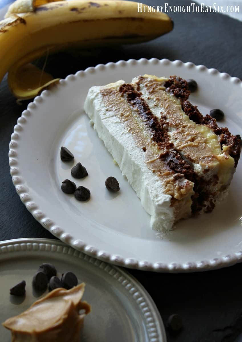 Layered chocolate, peanut butter, and whipped cream dessert.