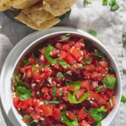 Bowls of chips and tomato salsa