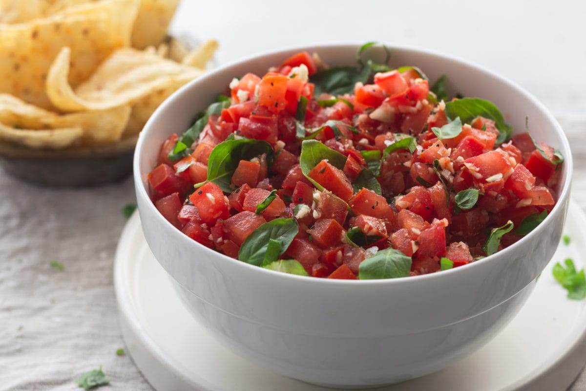 white bowl of tomato salsa