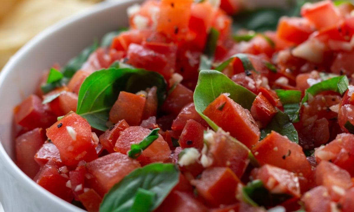 tomato salsa with basil leaves