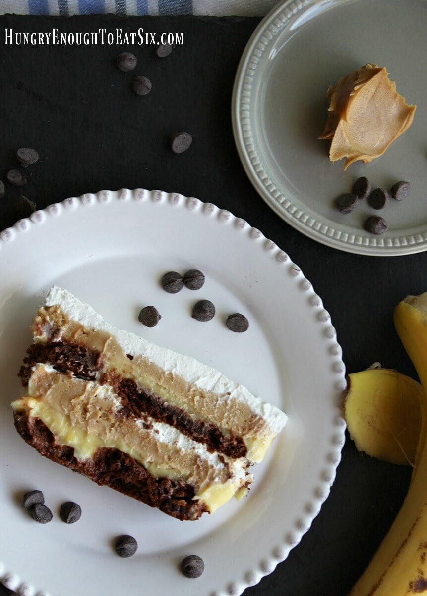 Peanut Butter Banana + Chocolate Icebox Cake! This easy, no-bake dessert is rich with creamy peanut butter and banana fillings, all held together by chocolate cookies.