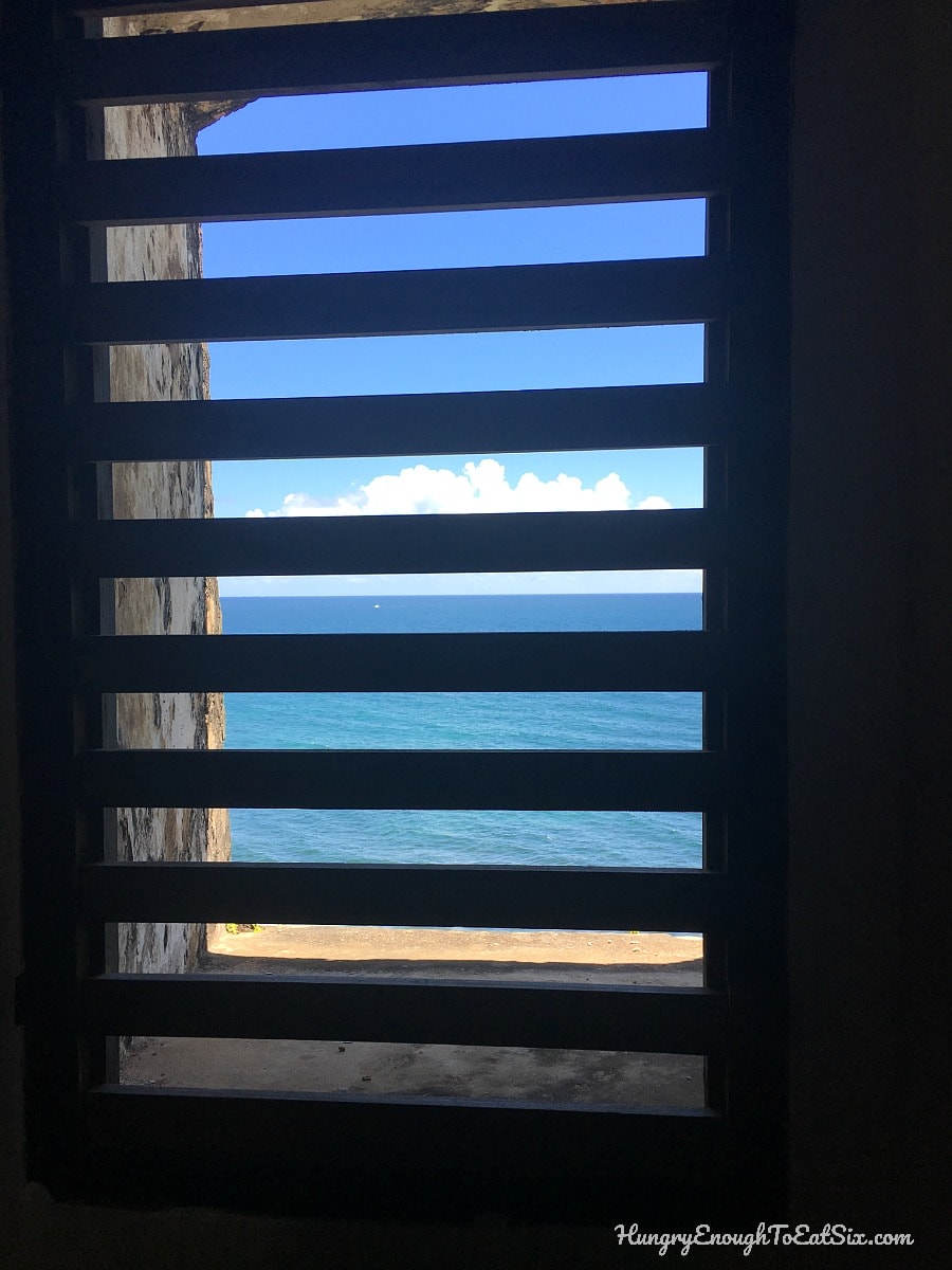 View of ocean through window slats