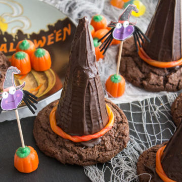 Chocolate cookies and cones assembled to look like witch hats