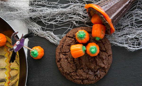 Orange mellowceme pumpkins on a chocolate cookie
