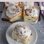 Baked sweet rolls with white frosting.