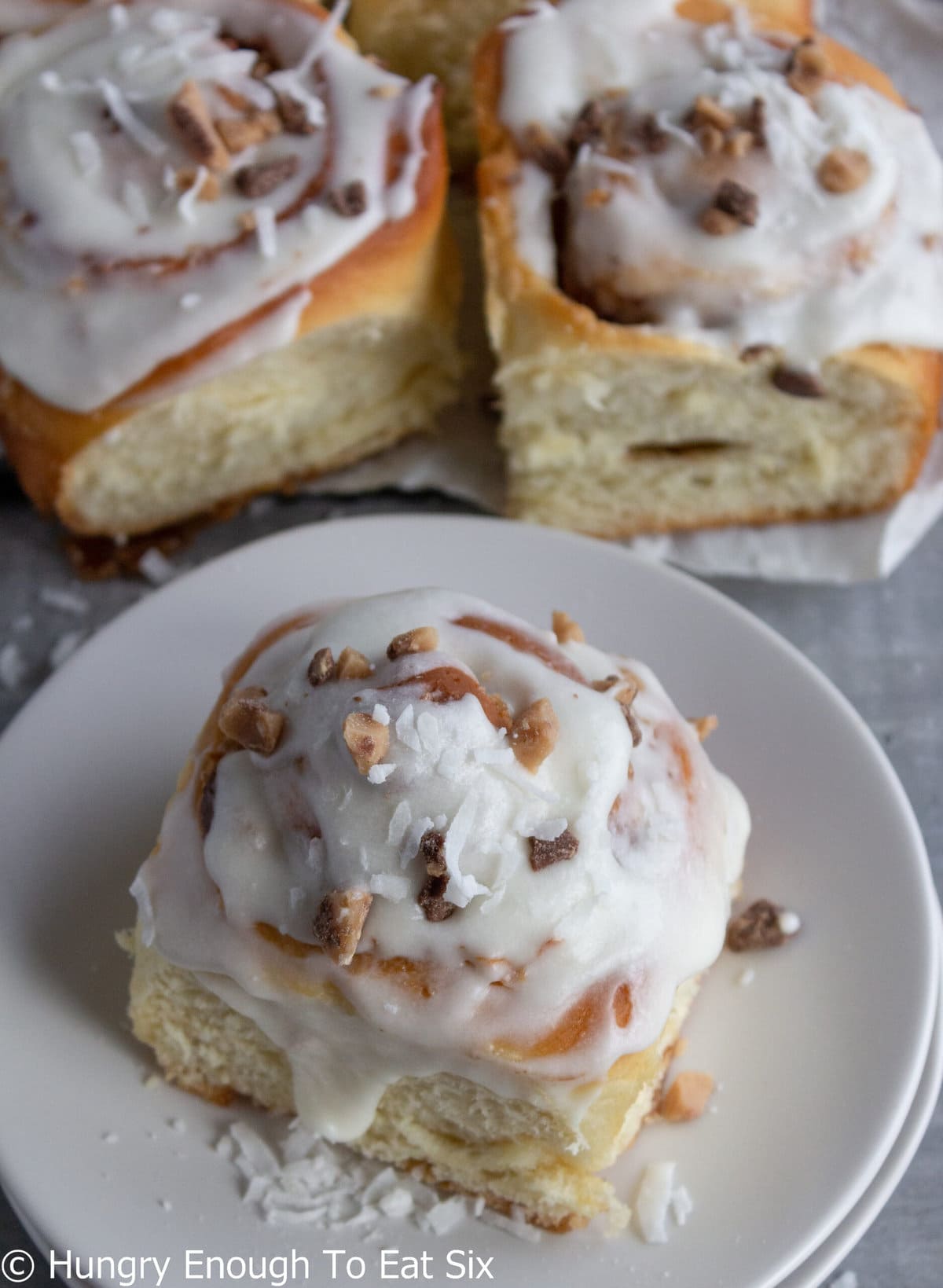 Swirled sweet buns with white icing.