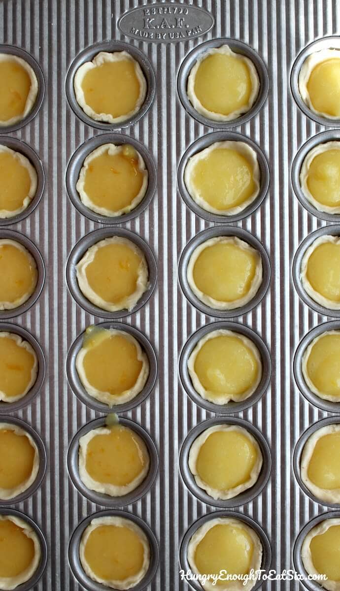 Mini tarts filled with sweet orange curd and topped with sweeter maple cream!