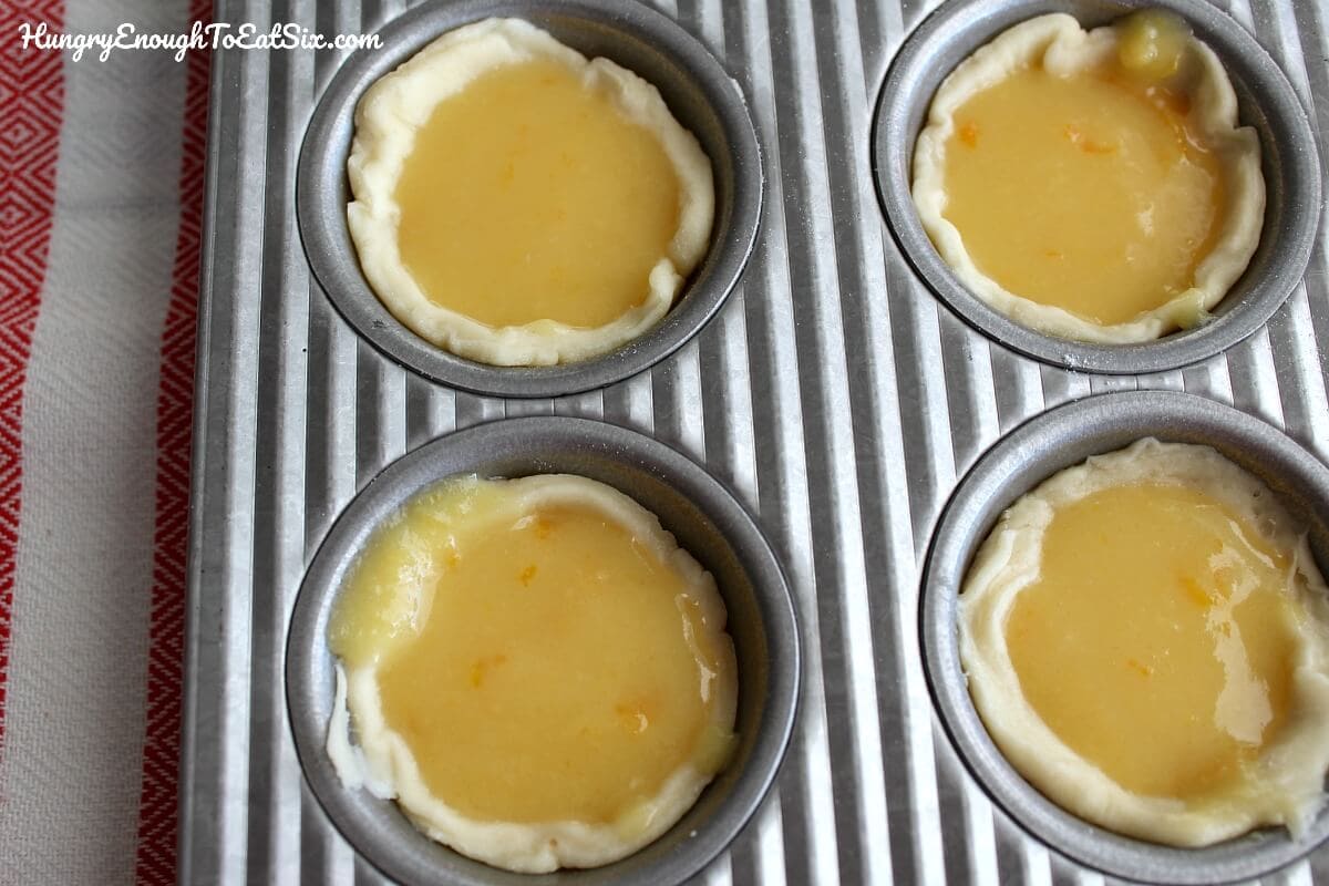 Mini tarts filled with sweet orange curd and topped with sweeter maple cream!