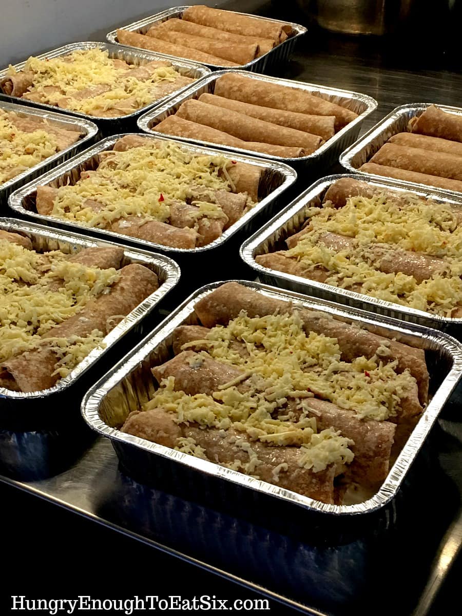 Foil pans filled with enchiladas