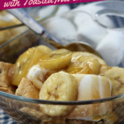 Glass dish of sliced bananas in rum syrup