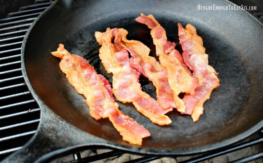 Bacon frying in a cast iron skillet