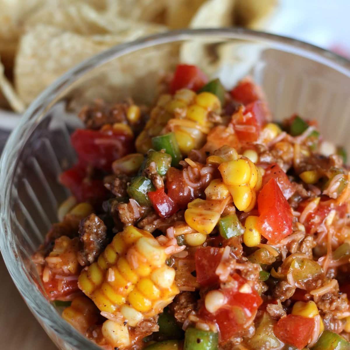 Image of Chopped Taco Salad in a glass bowl with Tortilla Chips