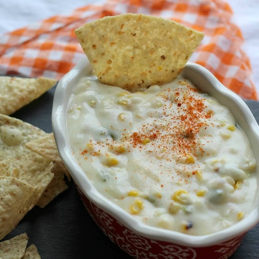 Queso cheese dip in a bowl with tortilla chips