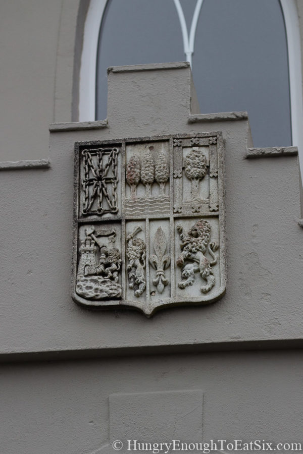 Image of coat of arms over doorway at Rossmore Manor