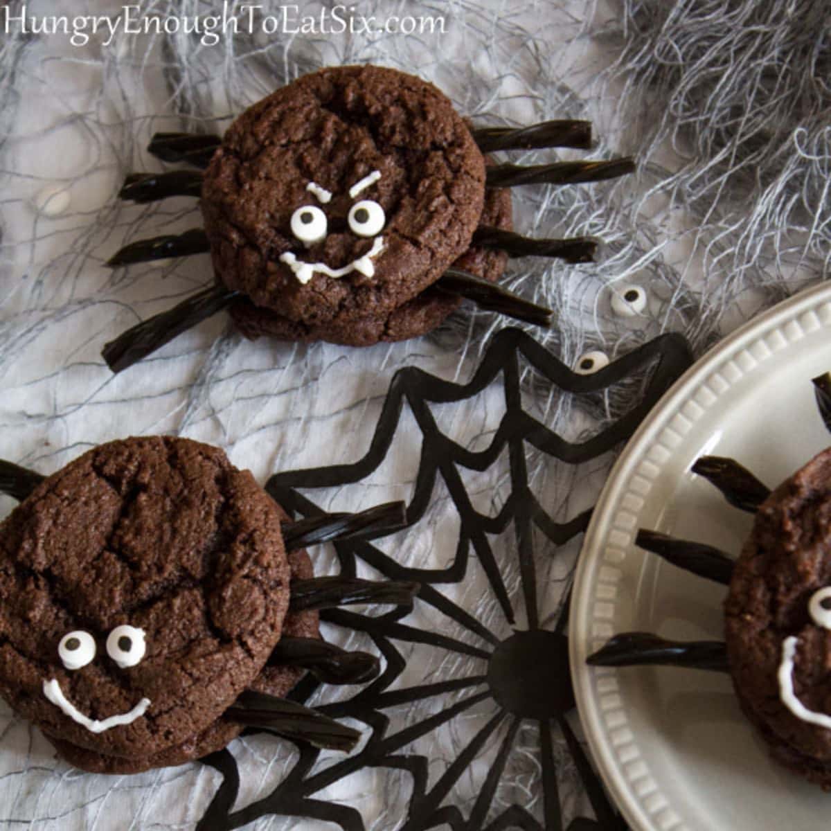 Chocolate sandwiched cookies with decorations to look like spiders