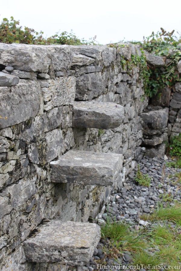 Stone wall with steps protruding out. 
