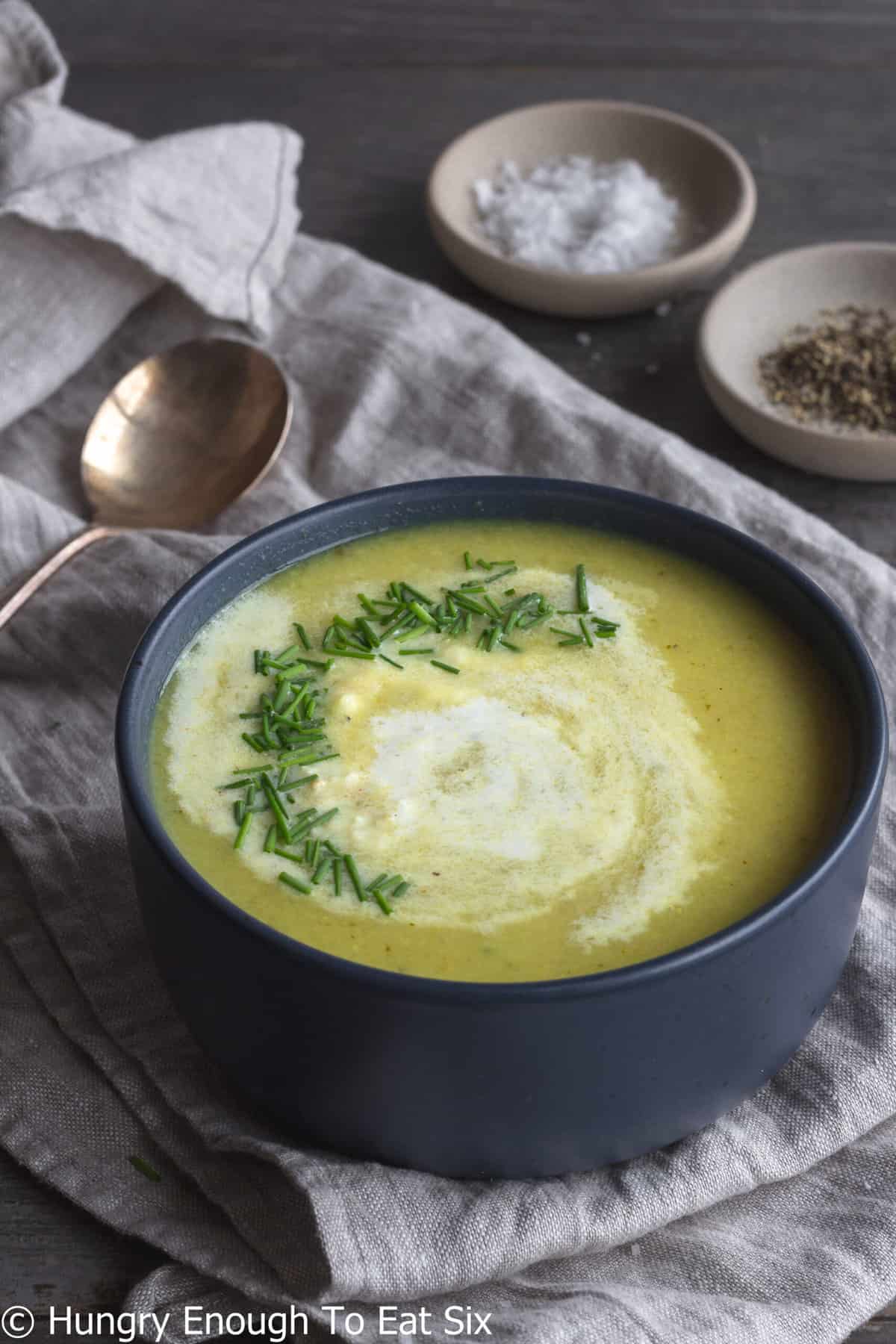 Curry soup with swirl of cream and chives.