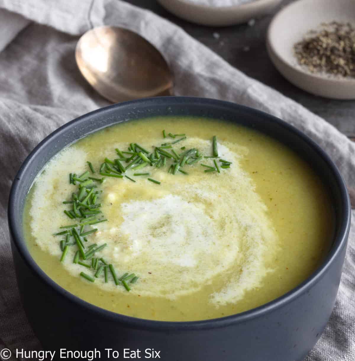 Yellow curry parsnip soup with cream and chives.