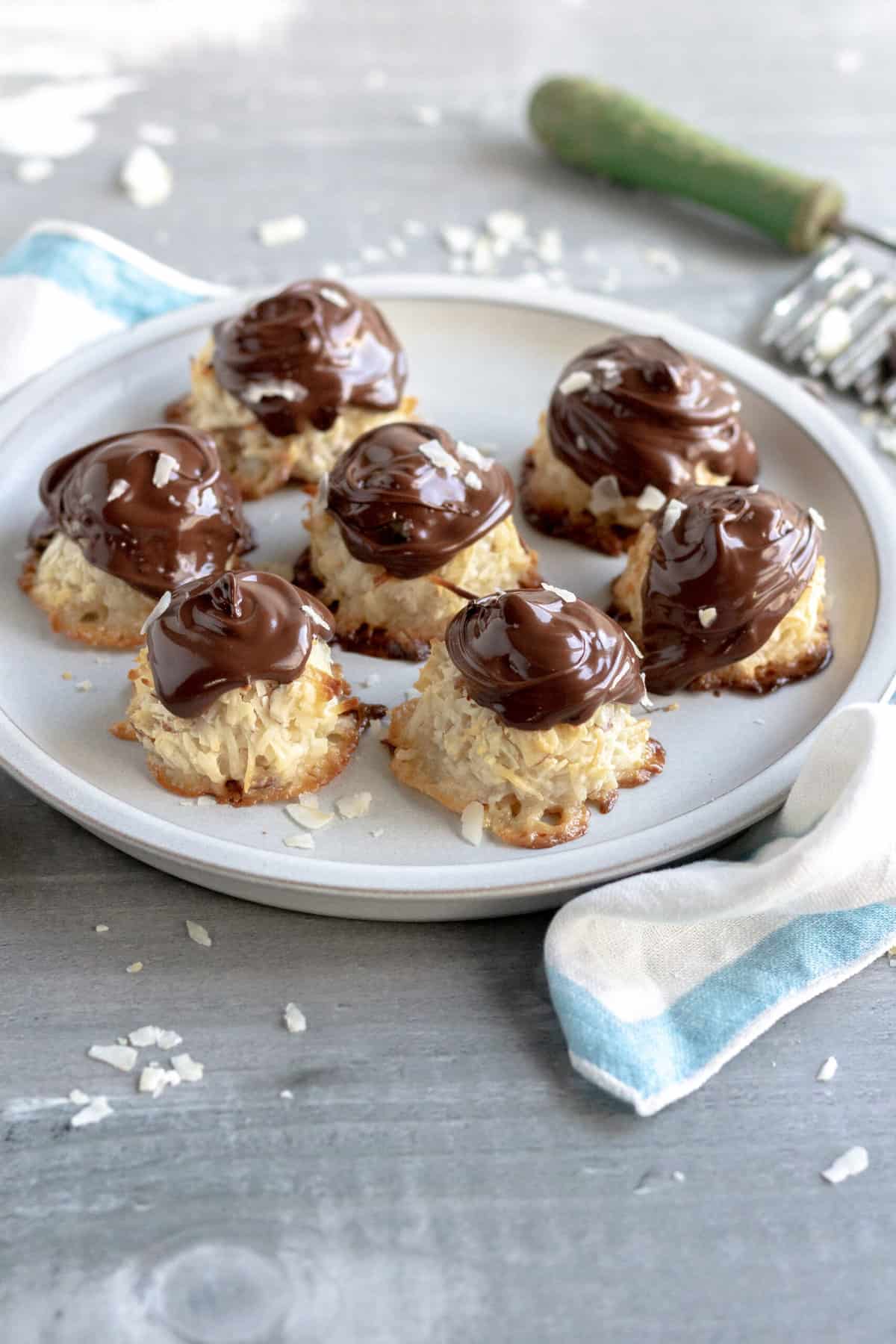 Macaroon candies with chocolate on top.