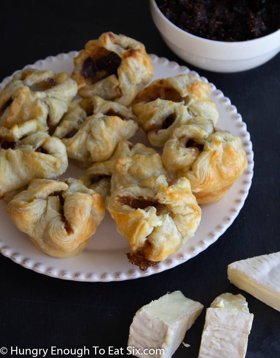 Puff pastry pockets of fig on a plate.